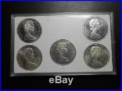 1965 uncirculated 5 types 1965 Canadian silver dollar, including medium bead var