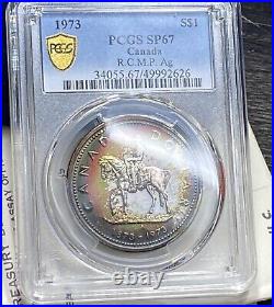 1973 $1 Canada Silver Dollar PCGS SP 67 Rainbow Toning Item 8002