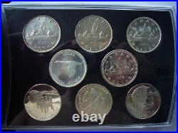 At Spot! Gorgeous 8 Canada Silver Dollars in Display Case Leather Like Cover