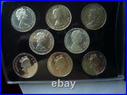 At Spot! Gorgeous 8 Canada Silver Dollars in Display Case Leather Like Cover